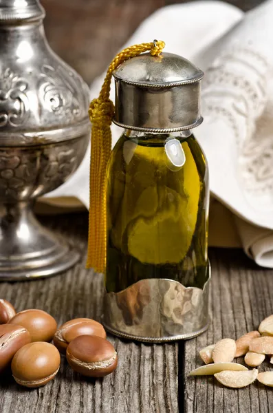 Argan oil with fruits — Stock Photo, Image