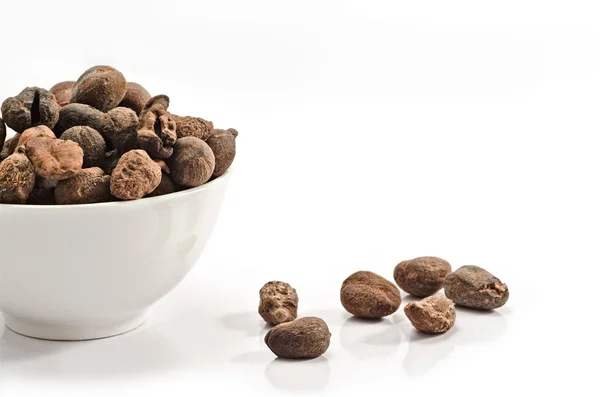 Cup full of shea nuts — Stock Photo, Image