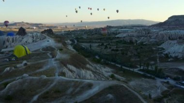 CAPPADOCIA, TURKEY - 08 03 2019: Flying balloons over the valley in Goreme in Cappadocia in Turkey drone view