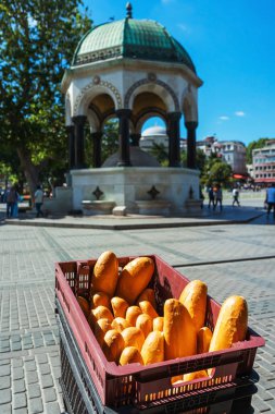 Fresh white bread in a box on the street in Istanbul. Turkish loaves popular bread in a plastic box