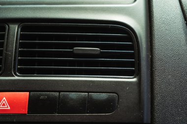 air conditioning system in the car. openings for supplying cold and hot air in a passenger car. plastic dampers for air supply