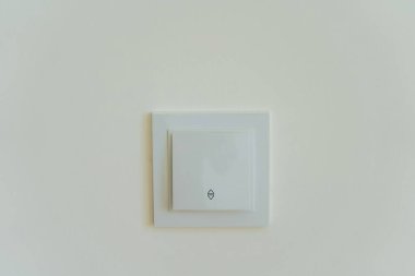 Electric socket on a white background. the center of switching on the light in the house. white plastic connectors