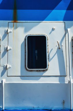 door to the engine compartment of the boat. ventilation window in the cabin with the engine. yacht metal door