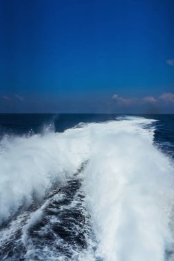 large waves from the operation of the boat's engines. water pressure from diesel engines. boat waves on mediterranean sea