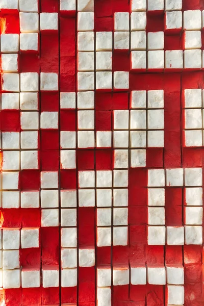 texture from white marble cubes. white squares on a red background. marble texture