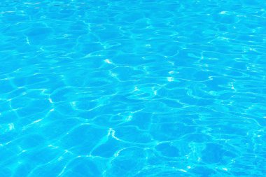 Clear blue water in a swimming pool in cyprus. pool water texture