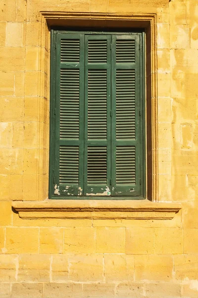 Old wooden windows in Cyprus. Wooden shutters from the sun and wind. ancient architecture of cyprus