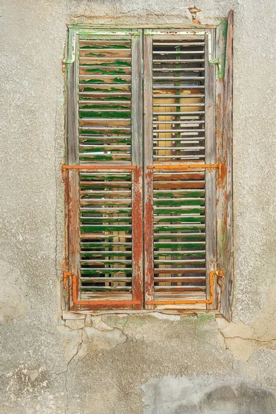 Old wooden windows in Cyprus. Wooden shutters from the sun and wind. ancient architecture of cyprus