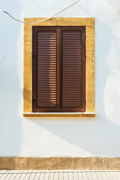 Old wooden windows in Cyprus. Wooden shutters from the sun and wind. ancient architecture of cyprus