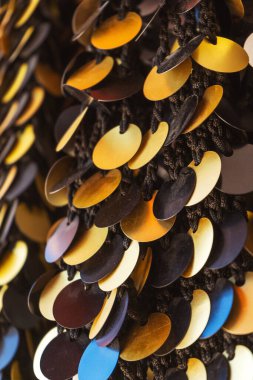 The texture of large sequins on the fabric. gold sequins sewn to the canvas. sequins for belly dancing