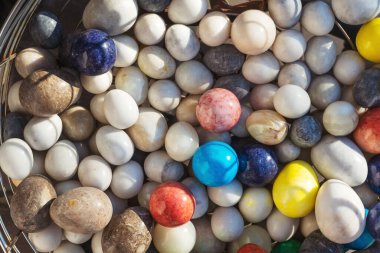 Polished stones on the counter in Turkey. Round polished stones for the treatment of energy diseases
