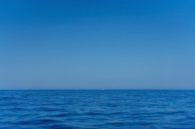The crystal clean water of the Mediterranean coast. Blue water with a shade of green on the Turkish coast. The texture of the blue sea