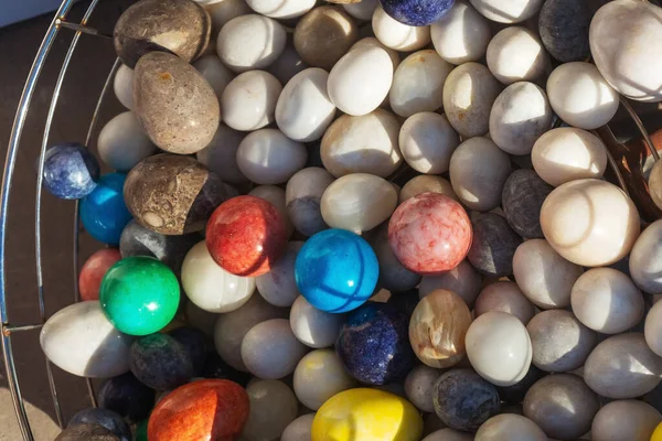 Polished stones on the counter in Turkey. Round polished stones for the treatment of energy diseases