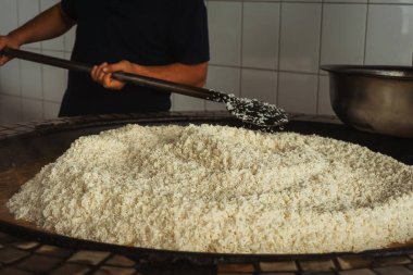 uzbek plov in tashkent. cooking pilaf in the tourist place of uzbekistan