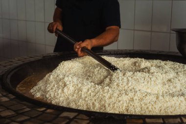 uzbek plov in tashkent. cooking pilaf in the tourist place of uzbekistan