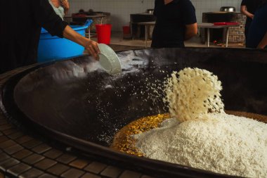uzbek plov in tashkent. cooking pilaf in the tourist place of uzbekistan