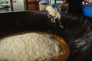 uzbek plov in tashkent. cooking pilaf in the tourist place of uzbekistan