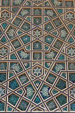 national patterns in the architecture of uzbekistan. photograph of a wall in a Tashkent mosque. national wall decoration with blue tiles in uzbekistan