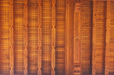 carved wooden elements on the wall of the Uzbek house. texture of carved wood in the tourist temple of tashkent. handmade by uzbek carpenters in tashkent