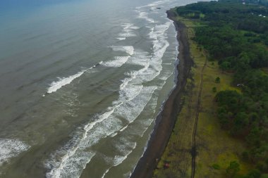 healing black sand beach in georgia. Magnetic sand on the beach in Magnetiti Batumi. High waves in the black Georgian sea in the village of Ureki