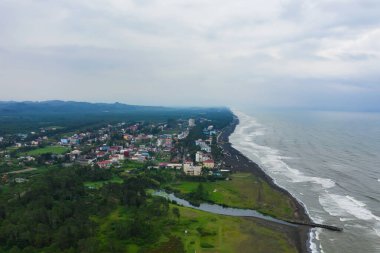 Hotels on the coastline with black sand in georgia. Magnetic sand on the beach in Magnetiti Batumi. Therapeutic boarding houses in the Ureki settlement for sick children