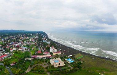 Hotels on the coastline with black sand in georgia. Magnetic sand on the beach in Magnetiti Batumi. Therapeutic boarding houses in the Ureki settlement for sick children