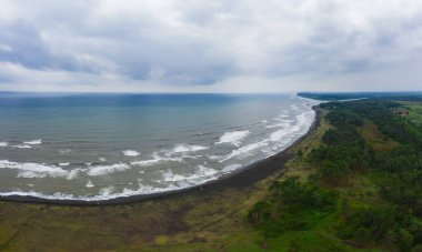 healing black sand beach in georgia. Magnetic sand on the beach in Magnetiti Batumi. High waves in the black Georgian sea in the village of Ureki