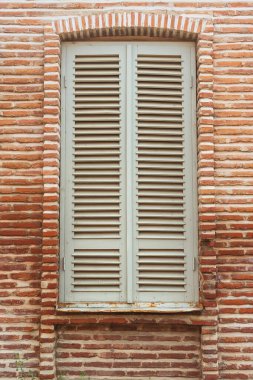 atmospheric windows in old Georgian houses. wooden beautiful windows with shutters in tbilisi. windows with wind protection glass