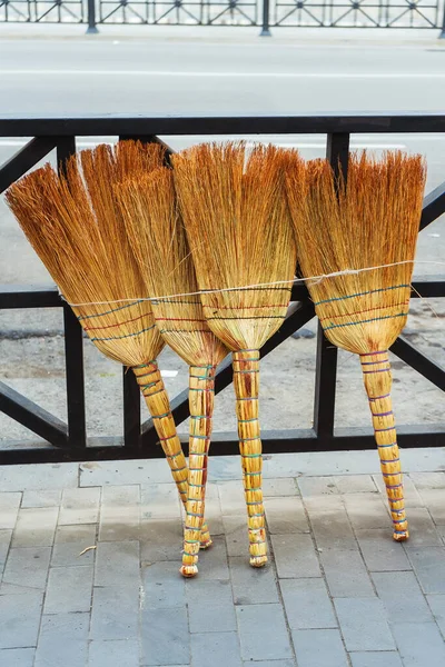 eco-friendly broom for sweeping sidewalks. a real broom made of branches for garbage collection