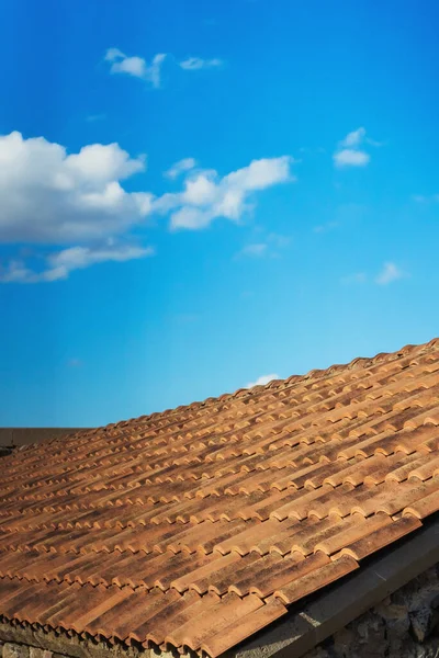 old roof tiles on the roof of a house in georgia. Eco-friendly clay tile rainproof