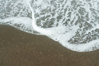sandy shore of the black sea. clean beach with high waves in georgia