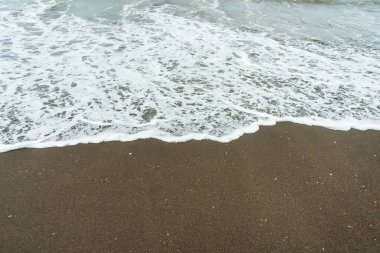 sandy shore of the black sea. clean beach with high waves in georgia