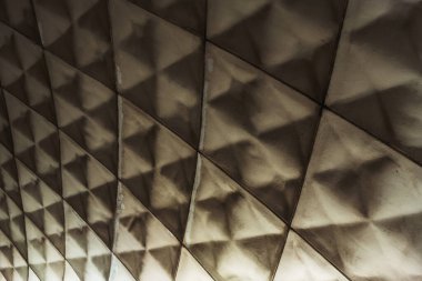 Ceiling interior of old subway in tbilisi. Rhombus texture in metro tunnel