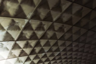 Ceiling interior of old subway in tbilisi. Rhombus texture in metro tunnel