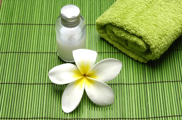 Frangipani flower on green mat — Stock Photo, Image