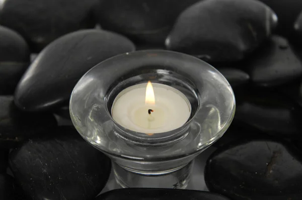 Candle with pebbles — Stock Photo, Image