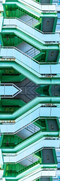 green fire escape ladders on building, Exterior view