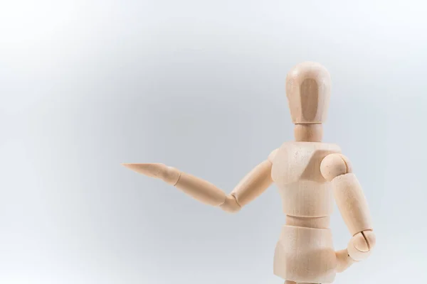 Wooden Dummy Proudly Presents Some Invisible Thing Isolated White Background Royalty Free Stock Photos