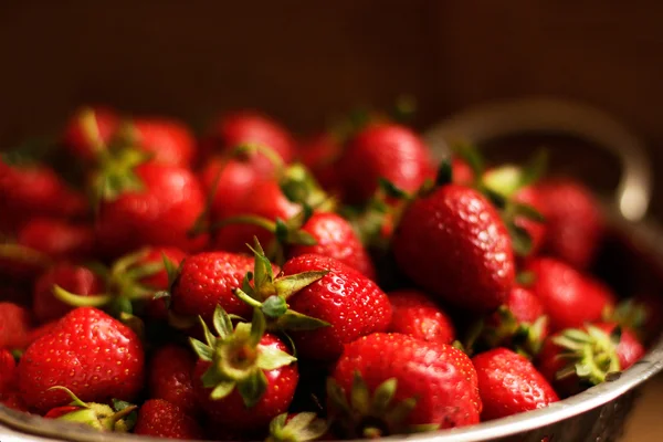 Fresh strawberries in colander — Stock Photo, Image