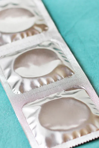Preservativos sobre fondo azul —  Fotos de Stock