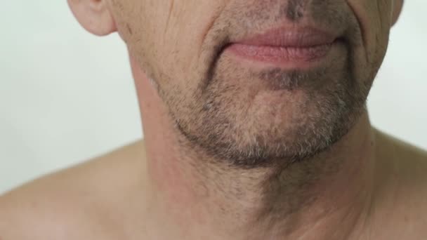 Close-up of a mans face before shaving — Stock Video