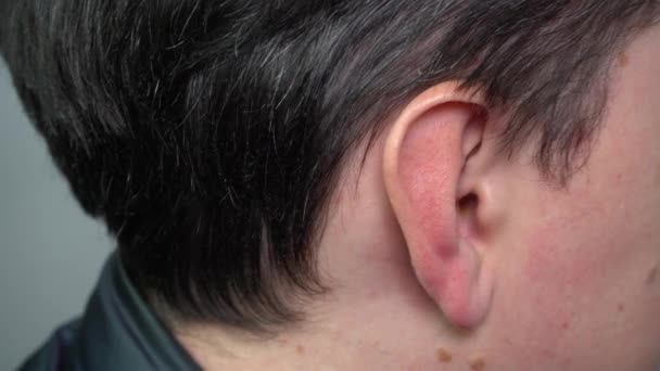 The ear of a young man in close-up — Stock Video