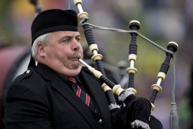 Piper at the Cowal Gathering - Scotland clipart