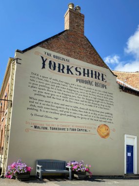 The original Yorkshire Pudding recipe which dates from 1747, on a wall in the market town of Malton in North Yorkshire, United Kingdom. clipart