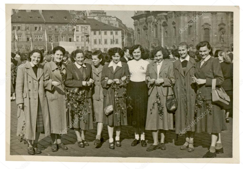 Group of young women in front of buildings