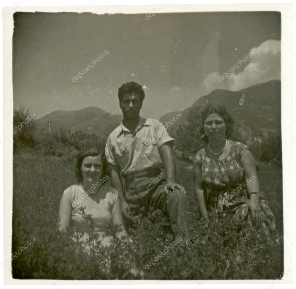 Two women and a man in the mountains