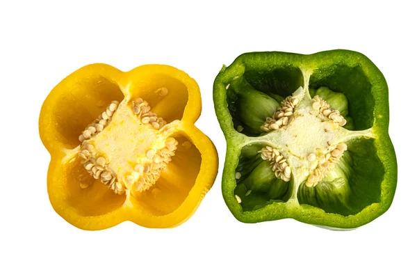 Two halves of yellow and green peppers on a white background — Stock Photo, Image