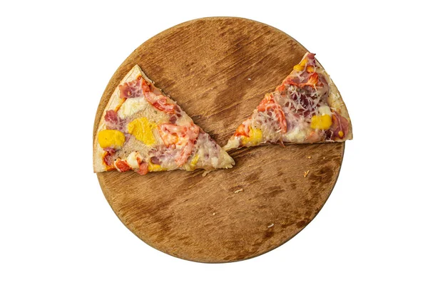 Two slices of pizza on a round wooden board on a white background top view — Fotografia de Stock