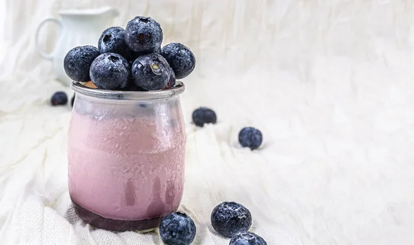 Bowl of blueberries in a high key background. High quality photo