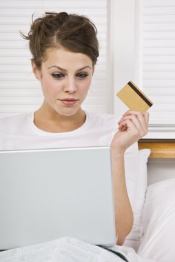 Attractive Woman with Credit Card and Laptop clipart